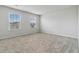 Carpeted bedroom features two windows allowing for lots of natural light to enter at 340 Paulownia Cir, Mcdonough, GA 30253