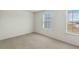 The carpeted bedroom features two windows and neutral walls at 340 Paulownia Cir, Mcdonough, GA 30253