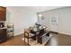 Cozy dining area adjacent to the kitchen, featuring a wooden table with bench seating, and an exterior door at 340 Paulownia Cir, Mcdonough, GA 30253