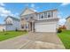 Beautiful two-story home with a two-car garage, large driveway, well-manicured lawn, and attractive curb appeal at 340 Paulownia Cir, Mcdonough, GA 30253