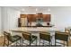Modern kitchen with granite countertops, stainless steel appliances, a large island, and breakfast bar seating at 340 Paulownia Cir, Mcdonough, GA 30253