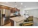 Contemporary kitchen boasting a large island with seating, stainless steel appliances, and open layout at 340 Paulownia Cir, Mcdonough, GA 30253