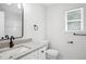 Bathroom featuring a white vanity with granite counters and modern fixtures at 3688 Burnley Court, Lithonia, GA 30038