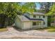 Charming two-story home with light green siding, covered porch, and a well-maintained front yard at 3688 Burnley Court, Lithonia, GA 30038