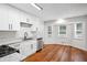 Modern kitchen with white cabinetry, granite countertops, stainless steel appliances, and a breakfast nook at 3688 Burnley Court, Lithonia, GA 30038
