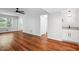Bright living room with hardwood floors, ceiling fan and access to dining area and outdoor area at 3688 Burnley Court, Lithonia, GA 30038