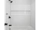 Shower featuring white subway tile and matte black hardware at 3688 Burnley Court, Lithonia, GA 30038