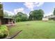 Backyard view with a screen room and green space at 4642 Elmhurst Dr, Douglasville, GA 30135
