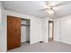 Neutral bedroom featuring carpet and closet storage with ceiling fan at 4642 Elmhurst Dr, Douglasville, GA 30135
