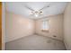 A cozy bedroom featuring neutral walls and a ceiling fan for added comfort at 4642 Elmhurst Dr, Douglasville, GA 30135