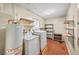 Laundry room with washer, dryer, water heater, and shelving for storage at 4642 Elmhurst Dr, Douglasville, GA 30135