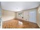 Inviting living room with wood floors, a front-facing window, and white door at 4642 Elmhurst Dr, Douglasville, GA 30135