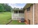 A screen room with white lattice detail and an AC unit at 4642 Elmhurst Dr, Douglasville, GA 30135