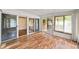 Inviting sunroom showcasing wood-look floors, and multiple glass sliding doors at 4642 Elmhurst Dr, Douglasville, GA 30135