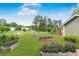 Expansive backyard featuring a swing set, landscaping, green lawn and flower beds at 620 Clearbrook Ct, Marietta, GA 30068