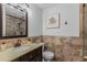 Bathroom featuring tile walls, tile floor, a vanity, and shower at 620 Clearbrook Ct, Marietta, GA 30068