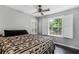 Cozy bedroom featuring wood floors and bright windows at 620 Clearbrook Ct, Marietta, GA 30068