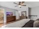 Bedroom featuring hardwood floors, ceiling fan, and ensuite bath with shower at 620 Clearbrook Ct, Marietta, GA 30068