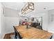 Open dining area showcases wood table, modern lighting, and access to the kitchen and living areas at 620 Clearbrook Ct, Marietta, GA 30068