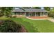 Charming single-story home featuring a well-manicured lawn and inviting front porch at 620 Clearbrook Ct, Marietta, GA 30068