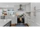 Bright kitchen with white cabinetry, quartz countertops, and stainless steel appliances at 620 Clearbrook Ct, Marietta, GA 30068