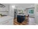 Updated kitchen with island, stainless steel appliances, and views of dining area at 620 Clearbrook Ct, Marietta, GA 30068