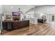 Open-concept living room features a stone fireplace, hardwood floors, and neutral paint at 620 Clearbrook Ct, Marietta, GA 30068