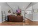 Spacious living room with stone fireplace, open to kitchen, and hardwood floors at 620 Clearbrook Ct, Marietta, GA 30068