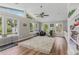 Sunroom with many windows, vaulted ceilings, and hardwood floors at 620 Clearbrook Ct, Marietta, GA 30068