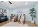 Well-lit basement featuring two massage chairs, decor, a house plant, and carpet at 2578 Middle Coray Cir, Marietta, GA 30066