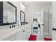 Bright bathroom with double vanity, black fixtures, and tiled floor at 2578 Middle Coray Cir, Marietta, GA 30066