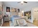 Bedroom with light wood floors, light walls, and an updated ceiling fan at 2578 Middle Coray Cir, Marietta, GA 30066