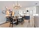 Elegant dining room with a chandelier, modern art, and a view of the kitchen at 2578 Middle Coray Cir, Marietta, GA 30066