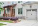 Home featuring a covered porch, a two-car garage, and manicured landscaping at 2578 Middle Coray Cir, Marietta, GA 30066