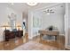 Elegant entryway featuring hardwood floors and a glimpse into a modern office space with stylish decor at 2578 Middle Coray Cir, Marietta, GA 30066