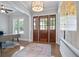 Inviting foyer with a decorative light fixture, hardwood floors, and a view of a bright office space at 2578 Middle Coray Cir, Marietta, GA 30066