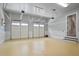 Expansive garage with white paneling, multiple doors, and overhead lighting, providing secure vehicle storage at 2578 Middle Coray Cir, Marietta, GA 30066