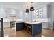 Bright kitchen with white cabinets, stainless steel appliances, and a dark blue island with seating at 2578 Middle Coray Cir, Marietta, GA 30066