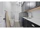 Well-organized laundry room with black cabinetry and modern appliances at 2578 Middle Coray Cir, Marietta, GA 30066