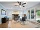 The expansive living room boasts a stone fireplace, ample lighting, and seamless outdoor access at 2578 Middle Coray Cir, Marietta, GA 30066