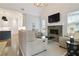 Bright living room with stone fireplace, white walls, and a view of the modern kitchen at 2578 Middle Coray Cir, Marietta, GA 30066