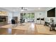 The spacious living room features a cozy fireplace, patio access and a modern workspace at 2578 Middle Coray Cir, Marietta, GA 30066