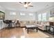 Inviting living room with a sectional sofa, hardwood floors, and bright windows, perfect for entertaining at 2578 Middle Coray Cir, Marietta, GA 30066