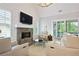 Comfortable living room with a stone fireplace, vaulted ceilings, and sliding doors to the outdoor area at 2578 Middle Coray Cir, Marietta, GA 30066