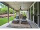 Comfortable outdoor patio featuring lounge chairs, a ceiling fan, and access to lush backyard at 2578 Middle Coray Cir, Marietta, GA 30066