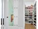 Well-organized shoe closet with multiple shelves for ample storage, showcasing an extensive footwear collection at 2578 Middle Coray Cir, Marietta, GA 30066
