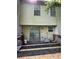 Exterior shot of back deck with a sliding glass door and two windows at 3739 Jamestown Ct, Doraville, GA 30340