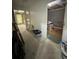 Unfinished basement with open doorway, ladder, boxes and walls in need of repair at 3739 Jamestown Ct, Doraville, GA 30340