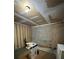 Unfinished basement with cinderblock wall, boxes, and exposed ceiling with lighting at 3739 Jamestown Ct, Doraville, GA 30340