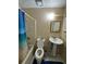 Modest bathroom featuring a pedestal sink, tile flooring, and combination tub and shower at 3739 Jamestown Ct, Doraville, GA 30340